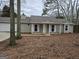 Ranch style home with attached garage and mature trees at 471 Glen Terrace Rd, Auburn, GA 30011