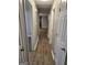 Bright hallway with wood-look floors and access to bedrooms at 471 Glen Terrace Rd, Auburn, GA 30011