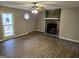 Spacious living room with stone fireplace and wood-look floors at 471 Glen Terrace Rd, Auburn, GA 30011