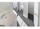 Bathroom featuring sink, toilet and storage shelves at 3905 Colonial Sw Trl, Lilburn, GA 30047