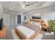Spacious main bedroom features a tray ceiling, soft lighting, and ample space to relax at 3905 Colonial Sw Trl, Lilburn, GA 30047