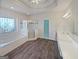 Large bathroom with walk-in glass shower, soaking tub, tile floors, vanity with double sinks and walk-in closet at 3905 Colonial Sw Trl, Lilburn, GA 30047