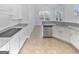 Bright kitchen with white cabinets, granite counters, and stainless appliances at 3905 Colonial Sw Trl, Lilburn, GA 30047