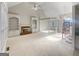 Bright living room with vaulted ceilings and a fireplace, awaiting your personal touches at 3905 Colonial Sw Trl, Lilburn, GA 30047