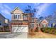 Beautiful two-story home featuring a brick and siding exterior and an attached two-car garage at 3905 Colonial Sw Trl, Lilburn, GA 30047