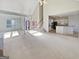 Open-concept living room and kitchen with white cabinets and island at 3905 Colonial Sw Trl, Lilburn, GA 30047
