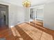 Elegant dining room with hardwood floors, wainscoting, and plenty of natural light at 3905 Colonial Sw Trl, Lilburn, GA 30047