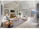 Bright living room with vaulted ceilings, a fireplace, and views of the entryway at 3905 Colonial Sw Trl, Lilburn, GA 30047