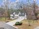 House with a three-car garage and driveway at 4267 Arbor Club Dr, Marietta, GA 30066