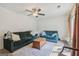 Spacious living room featuring plush sofas, a patterned rug, and ample natural light at 1144 Kipling Se St, Atlanta, GA 30315