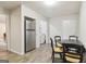 Cozy kitchen with stainless refrigerator and laminate floors, adjacent to a dining area at 1144 Kipling Se St, Atlanta, GA 30315