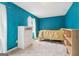 Comfortable bedroom features neutral carpet and a built-in bookshelf for storage and decor at 1144 Kipling Se St, Atlanta, GA 30315