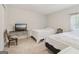 Spacious bedroom has neutral carpet, a well-lit room with TV, perfect for relaxation and entertainment at 1144 Kipling Se St, Atlanta, GA 30315