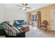 Bright living room with a large window and plush seating, featuring a stylish ceiling fan at 1144 Kipling Se St, Atlanta, GA 30315