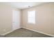 Cozy bedroom with neutral walls and carpet flooring at 380 River Point Dr, Mcdonough, GA 30252