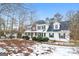 Two-story house with brick and white siding, porch, and landscaping. Winter scene at 380 River Point Dr, Mcdonough, GA 30252