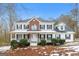 Two-story house with brick and white siding, porch, and landscaping at 380 River Point Dr, Mcdonough, GA 30252