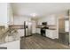 Kitchen with granite countertops, white cabinets, and stainless steel appliances at 380 River Point Dr, Mcdonough, GA 30252
