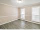 Spare bedroom with hardwood floors and neutral walls at 380 River Point Dr, Mcdonough, GA 30252