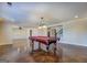 Basement recreation area with pool table and stained concrete floor at 45 Kinloch Ct, Covington, GA 30014