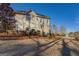 Two-story house with stucco siding, attached garage, and lake view at 45 Kinloch Ct, Covington, GA 30014