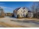 Two-story house with stucco siding, attached garage, and lake view at 45 Kinloch Ct, Covington, GA 30014