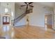 Open living room with hardwood floors and grand staircase at 45 Kinloch Ct, Covington, GA 30014