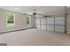 Spacious two car garage with windows, and an electric garage door at 123 Oak Road, Locust Grove, GA 30248
