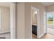 Hallway view showcasing bathroom, bedroom, and front door enhancing flow of the home at 123 Oak Road, Locust Grove, GA 30248