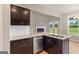 Modern kitchen island featuring granite countertops and stainless steel appliances at 123 Oak Road, Locust Grove, GA 30248
