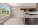 Modern kitchen featuring stainless steel appliances, granite countertops, and an open layout at 123 Oak Road, Locust Grove, GA 30248