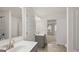 Bathroom with vanity, mirror, and tile flooring at 13232 Tolstoy Drive, Covington, GA 30014