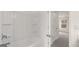 Bathroom with tub and shower, and access to bedroom at 13232 Tolstoy Drive, Covington, GA 30014