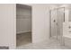 Bathroom features a walk-in shower, separate tub, and closet at 13232 Tolstoy Drive, Covington, GA 30014