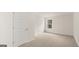 Bright bedroom with carpeting, window, and closet at 13232 Tolstoy Drive, Covington, GA 30014