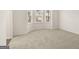 Spacious bedroom with neutral carpeting and a large window at 13232 Tolstoy Drive, Covington, GA 30014