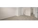 Spacious bedroom with carpet and access to bathroom at 13232 Tolstoy Drive, Covington, GA 30014