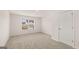 Well-lit bedroom with carpet and a window at 13232 Tolstoy Drive, Covington, GA 30014