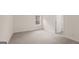 Well-lit bedroom featuring carpet and a window at 13232 Tolstoy Drive, Covington, GA 30014