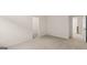 Bright bedroom with carpet, closet, and hallway access at 13232 Tolstoy Drive, Covington, GA 30014