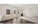 Open dining area with hardwood floors and fireplace at 13232 Tolstoy Drive, Covington, GA 30014