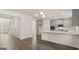 Open concept dining area with hardwood floors and kitchen access at 13232 Tolstoy Drive, Covington, GA 30014