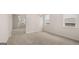 Open dining room with carpet and view of living room at 13232 Tolstoy Drive, Covington, GA 30014
