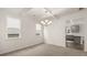 Dining room with chandelier and access to kitchen at 13232 Tolstoy Drive, Covington, GA 30014