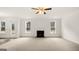 Spacious living room with fireplace and ceiling fan at 13232 Tolstoy Drive, Covington, GA 30014