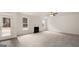 Living room with fireplace, hardwood floors, and door to patio at 13232 Tolstoy Drive, Covington, GA 30014