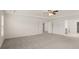 Bright and airy main bedroom with carpet and access to bathroom at 13232 Tolstoy Drive, Covington, GA 30014