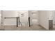 Upstairs hallway with view of stairs and other rooms at 13232 Tolstoy Drive, Covington, GA 30014