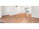 The open-concept living room features wood-look flooring and seamless transitions to other spaces at 507 Embers Se Dr, Marietta, GA 30067