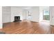 Bright living room featuring laminate flooring, built-in shelving, fireplace, and neutral colors at 507 Embers Se Dr, Marietta, GA 30067